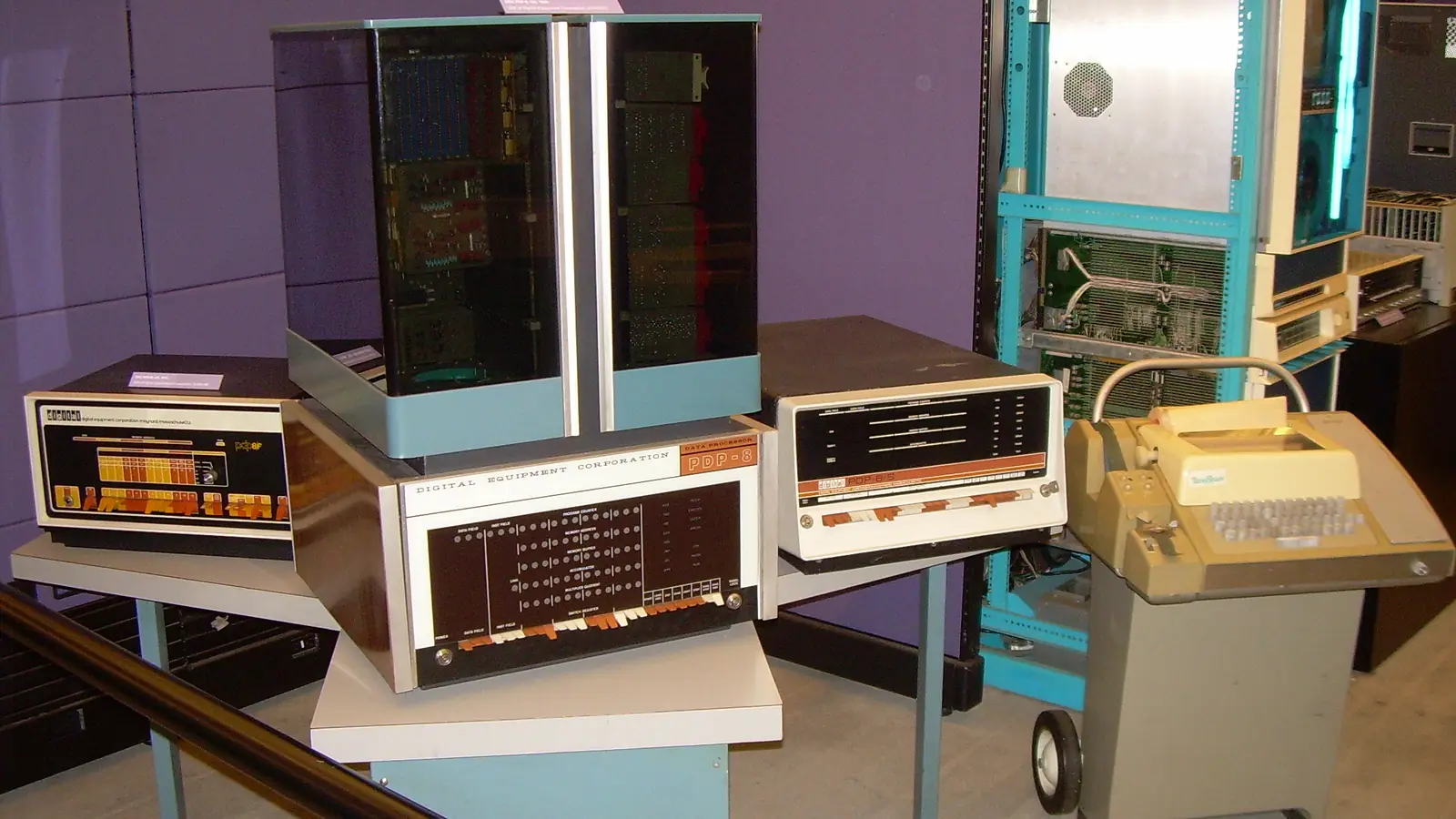 DEC PDP-8 computers displayed alongside a Teletype ASR-33